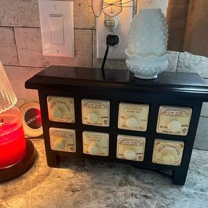 Vintage  FRench Apothecary cabinet black wood with cream ceramic drawers